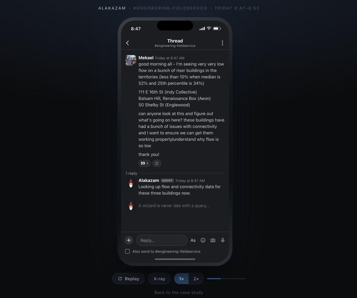A Slack thread on an iPhone. A coworker asks about unusually low flow at three-riser buildings, and Alakazam replies that it is checking flow and connectivity data.